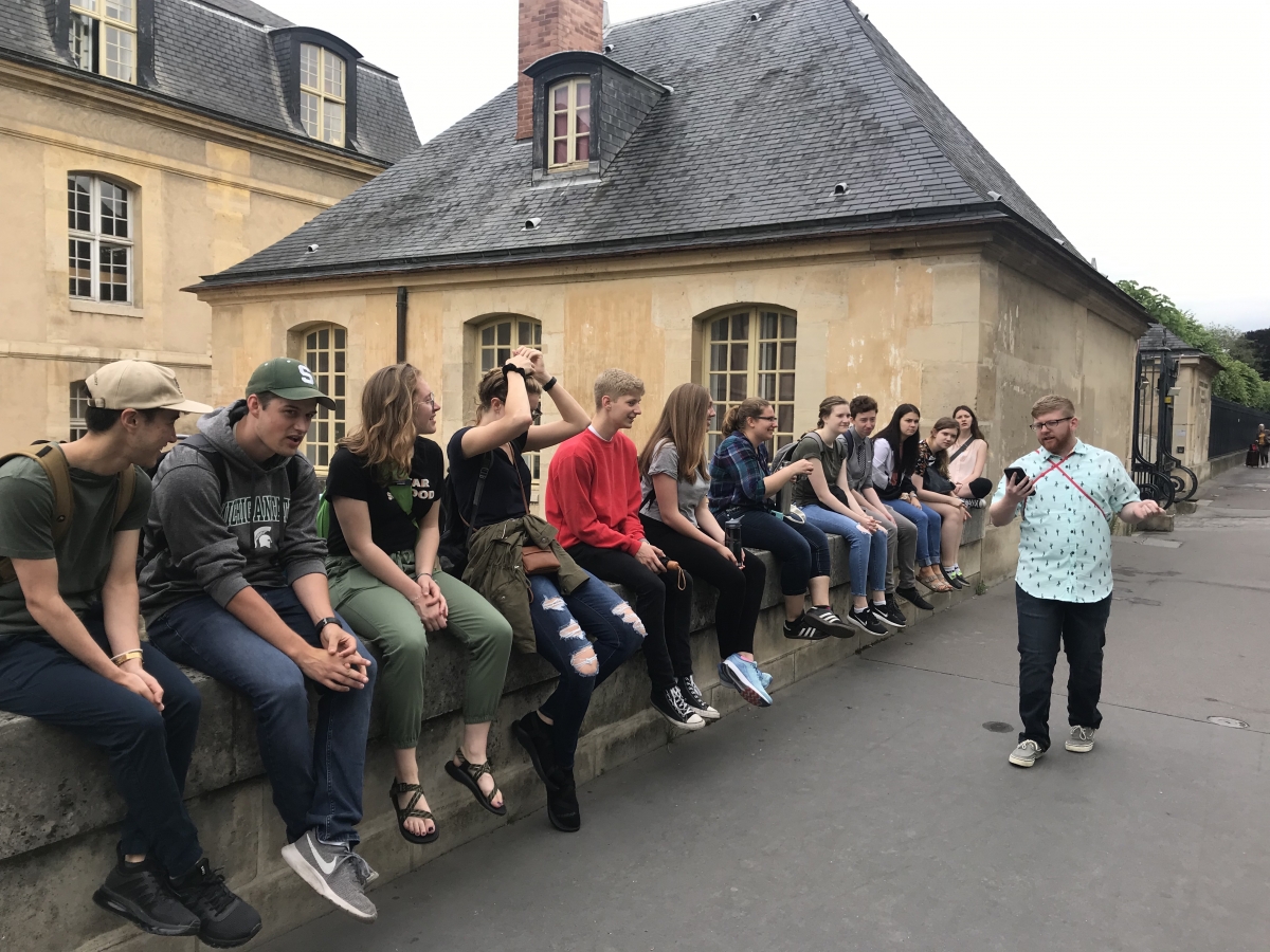 Student giving a presentation outside Napoleon's tomb.